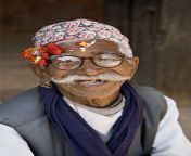 71037240 old nepali man wearing topi hat in mul cowk courtyard posing for tourists durbar square patan kathmandu valley.jpg from nepali old man s