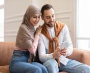 young muslim couple using cellphone sitting on cou tdtlhbr 350x250.jpg from little muslim sex