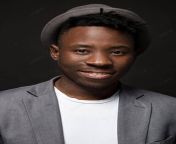 pngtree a smiling stylish black man posing on a black backdrop photo image 41901738.jpg from رجل اسود