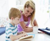 31000357 mother helping son with homework in kitchen.jpg from mom hilft son