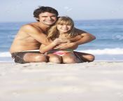 8483069 father and daughter wearing swimwear sitting on sandy beach.jpg from father and daughter nudist