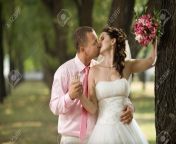 15719078 happy newly married couple romance embrace and kiss outdoor.jpg from newly wed couple kissing