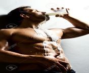 17221575 the very muscular handsome man drink milk and pour on body.jpg from milk sexy