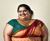 198364058 portrait of a fat woman wearing a saree and smiling at the camera.jpg from fat woman indian deshi aunty sexsnjali sex randi bazaar image line xxx