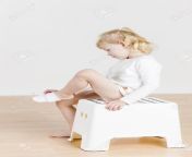 51098395 sitting little girl changing the clothes.jpg from little changing