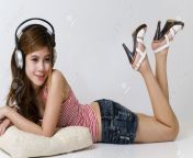 7229425 young girl listening to music on headphones.jpg from photo sexi young
