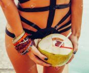 123584900 close up of thirsty lady in black sensual swimsuit hold open cool coconut in hand with lot of.jpg from coll grle hot sexexy sunny leano xmx xxx