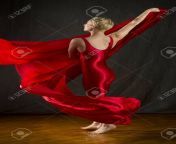 93238328 active young woman dancer with short blonde hair in a red unitard dramatically swirling red fabric.jpg from red blonde dancing