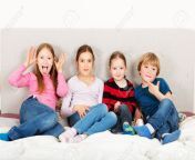 58928684 group of 4 kids three girls and one boy playing on parent s bed.jpg from 3 gril 1boy