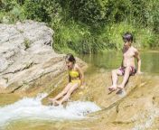 47043316 young boy and little girl bathing while crossing a river in catalonia spain.jpg from young bath in river