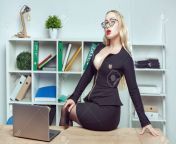 136906566 young woman with big sits on a table in an office near a laptop.jpg from big boobs ofice