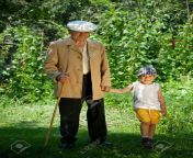 10501790 portrait of small boy helping a old man on walking outdoor.jpg from old man small