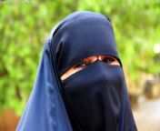 iraq baghdad a woman smiles with her eyes wearing the islamic niqab headdress img 9553sm.jpg from iraqi sexci dones arab niqab hijab muslim sex videos