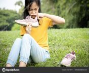 depositphotos 322419374 stock photo asian female teenage is sniffing.jpg from red13bull stink feet