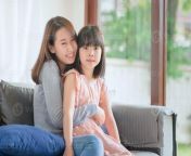 asian mother feel hapiness during hug her cute daughter with love and care at home photo.jpg from mom holds daughter to get facial