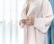 beautiful and sexy asian breast in front of hotel curtain light inside pastel pink t shirt photo.jpg from hotel breast