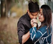 love story of indian couple posed outdoor man kiss her hand photo.jpg from desi couple romance 17
