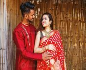 beautiful indian young couple husband touching a tummy of his pregnant wife who is expecting a baby photo.jpg from india husb