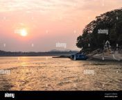 sunset orange sky with river island backdrop at dusk image is taken at peacock island guwahati assam india it is showing the serene beauty of nature 2cdhn14.jpg from assam beauty showing