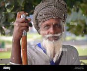 old indian sikh devotee with bloodshot eyes rests on his walking stick and looks into the camera 2cayp71.jpg from old man sikh punjabi sixy video