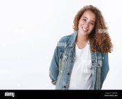 charismatic cute happy modest chubby young curly haired girl hold hands behind pleasantly smiling timid tender grin tilting head silly wanna help 2a6ferx.jpg from charming chubby stock photos amp roy