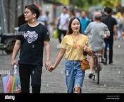 chinese couple walking holding hands in hubu alley wuhan china 2a7hj9h.jpg from chinese gf bf