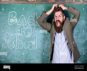 hate school teacher or educator stands near chalkboard with inscription back to school teacher unhappy shouting hysterically face teacher goes mad about schooling man refuses begin work at school 2amaeg5.jpg from à¤²à¤¡à¤à¤à¥à¤¤ school teacher sex video