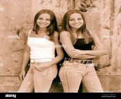 teenage twin girls standing by wall outdoors 2ar24gy.jpg from twins girles xxx bf wwwco