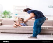 the angry father punishing his daughter 2arp52g.jpg from father punished daughter