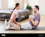 girlfriend sitting on boyfriends legs helping him exercise at home 2c456bf.jpg from sit on his leg