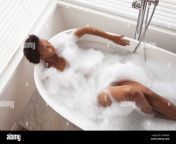 woman relaxing in a bathtub 2c664gk.jpg from women tub in