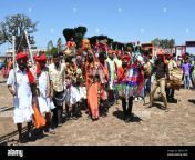adivasi tribal men faces and bodies decorated wearing ornate headgear dancing to celebrate holi festival kavant gujarat india asia 2btyc7w.jpg from gujarat adivasi