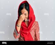 middle age hispanic woman wearing tradition sherwani saree clothes tired rubbing nose and eyes feeling fatigue and headache stress and frustration co 2ehx8h0.jpg from saree rubbing