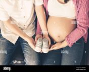 pregnant couple of husband and wife feels love and relax at home young expecting woman holds baby in pregnant belly father take care of pregnant 2d8a8m8.jpg from دوبی رقصxx videos asia wife pregnant 3gp