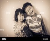 little asian thai children happily brother and sister smiling loving and bonding of sibling concept cream tone background vintage picture style 2g2nrm9.jpg from download video brother sister thai ma ke chat