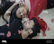 an indian couple lying on a bed and happily touching each other first night concept 2g8a43a.jpg from indian couples romantic first night s