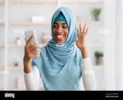 cheerful black muslim woman in hijab making video call with smartphone 2g9a9wf.jpg from hijab video call