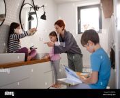 mother with three little children in bathroom morning routine concept 2hpr1ja.jpg from 1 mom son bathroom inner sextamil
