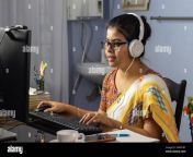 indian woman in saree working on computer and talking over internet from home online teaching concept 2hwp1ry.jpg from indian desi saree desk