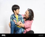 happy indian grandmother and grandson hug sit on floor look at each other smiling isolated on white studio background retired grandma with little gr 2k8j0x7.jpg from indian old granny and son sex video somran se