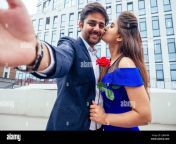 happy asian man in stylish black suit making selfie photo with his beautiful woman after proposal and giving gold ring on the background of the 2j849hm.jpg from cute indian lover romance gf give nyc blowjob mp4