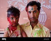 father and son celebrating the holi spring festival to celebrate the love between krishna and radha in govind devji templejaipur rajasthan india 2ntrt0r.jpg from rajasthan xxx komom son fahter