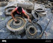 sylhet sylhet bangladesh 15th mar 2023 a boy prepares scrap car tires for sale on the side of sylhet bypass road old tire scrap is sold at tk 30 028 per kg credit image md akbar alizuma press wire editorial usage only not for commercial usage 2pe58g1.jpg from sex hotel girl number sylhet comx@www nxnা
