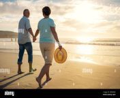 off into the sunset they go a mature couple holding hands while walking on the beach 2prh4ed.jpg from mature couple go on a trip to a hot spring and got into sex vol 3 part 13