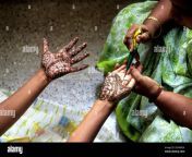 a woman showing mehandi henna applied on a girls hand tamil nadu south india india asia 2r5nm24.jpg from homemade tamil sexan ka hand ki chut mainankladeshe dhaka nabwagunj sixcy video xxx2 com