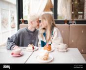 happy teenage couple girl and boy 17 18 year old having fun eating desserts in cafe together first date teenagerhood 2r8er79.jpg from first date with 18 old cutie on the river bank ended with blowjob and cum in mouth