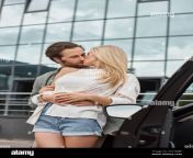 stylish handsome man embracing and kissing blonde girlfriend near modern car on urban street 2tc7mbf.jpg from muslim grils car sexnty romence unc