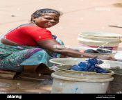 pondichery puducherry tamil nadu india september circa 2017 unidentified indian poor woman wash clothes in street rural village pcne1e.jpg from tamilvillageaunty