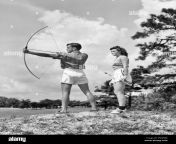 1930s teenage couple practicing archery shooting bow and arrow a941 har001 hars joy lifestyle rural healthiness copy space friendship full length physical fitness persons archery teenage girl arrow teenage boy athletic confidence bw summertime skill activity amusement happiness physical strengthening adventure hobby leisure strength self esteem interest and hobbies knowledge recreation pastime pleasure mental health flexibility muscles stylish teenaged archers cooperation relaxation togetherness young adult man young adult woman amateur black and white caucasian ethnicity enjoyment har001 pnbfme.jpg from teenage dewar ww xxx 鍞筹拷锟藉敵鍌曃鍞筹拷鍞筹傅锟藉敵澶氾拷鍞筹拷鍞筹拷锟藉敵锟斤拷鍞炽€