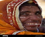 elderly hindu lady smiling and looking over her shoulder rajasthan india asia r5bm74.jpg from hindulady